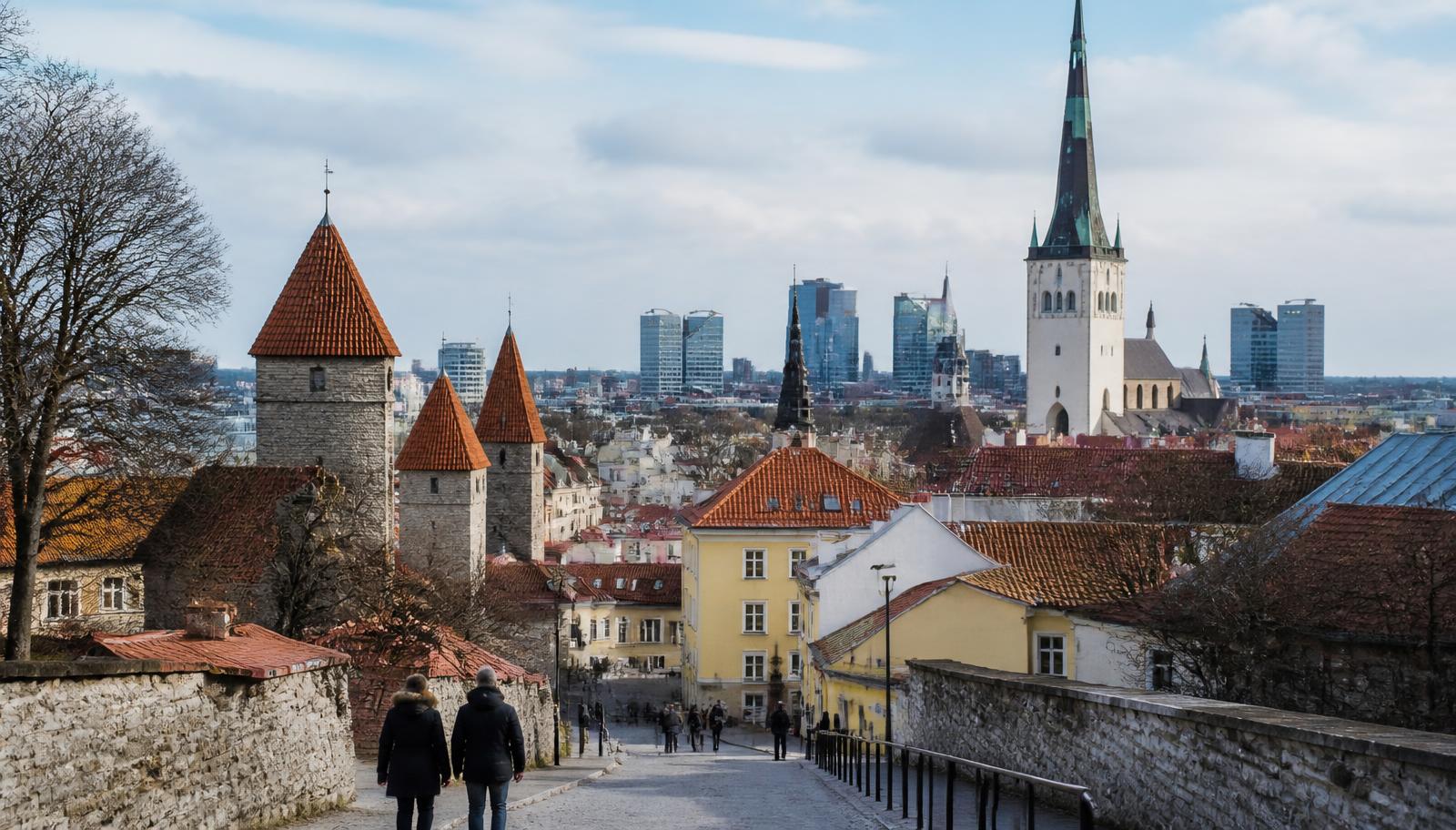 Tallinn Old Town rooftops and church spires with the modern city business district behind